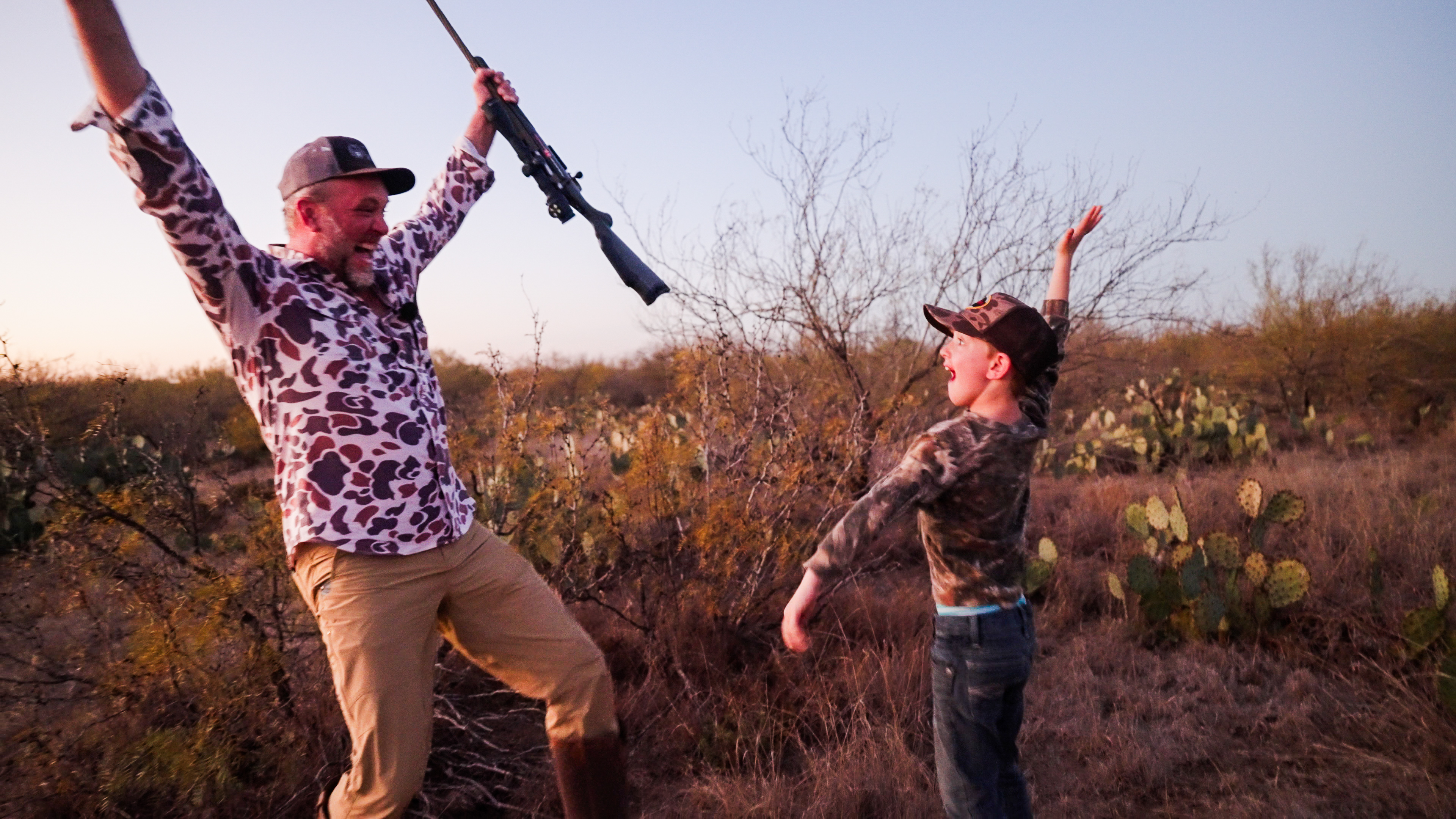 Father and son celebrating after hunt